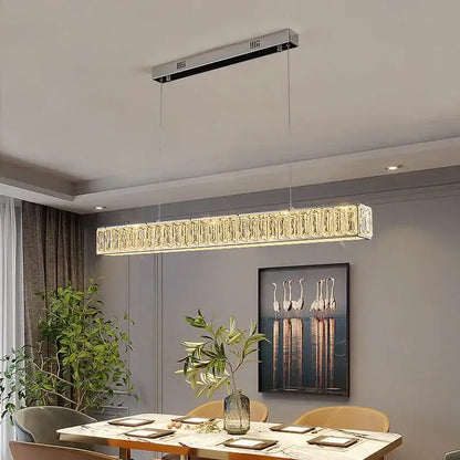 Modern luxury decorbites crystal chandelier led with a sleek silver frame and faceted crystals emitting warm golden light