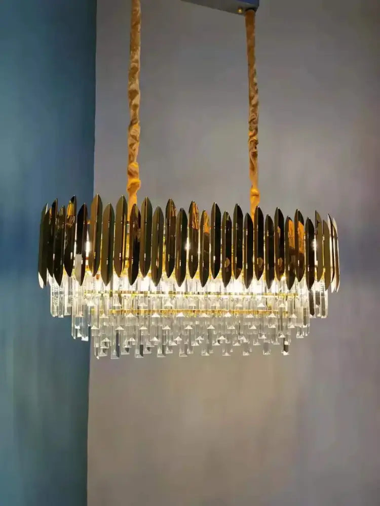 Gold-toned decorbites crystal chandelier pendant light with circular metallic blades and clear crystal droplets for luxury décor