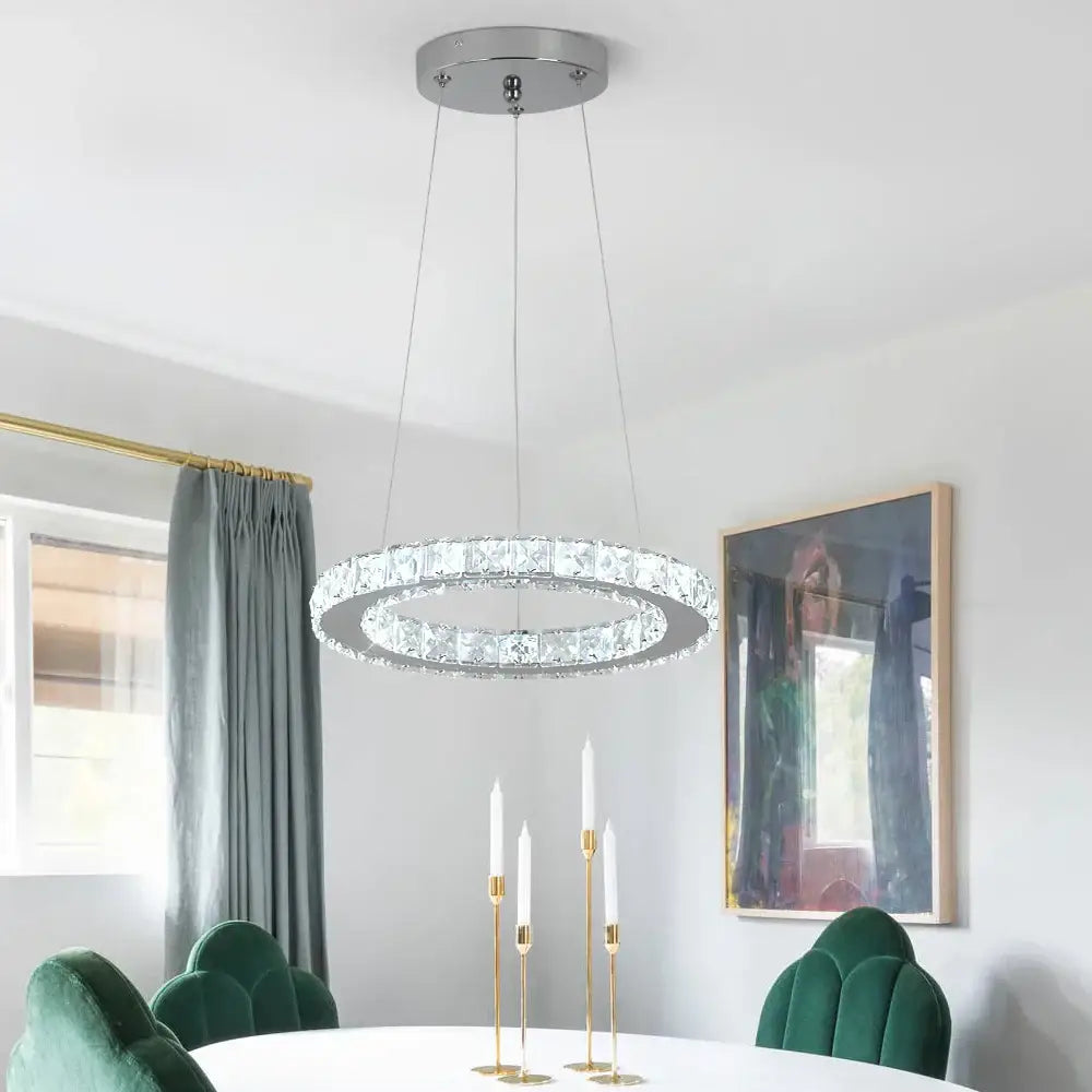 A modern DecorBites crystal chandelier led pendant with chrome finish and embedded clear crystal for living room lighting
