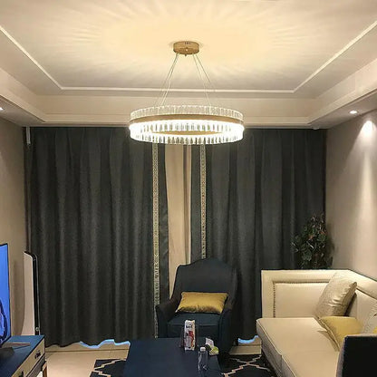 A modern decorbites crystal chandelier led with gold ceiling mount and clear faceted crystals for dining living room and bedroom