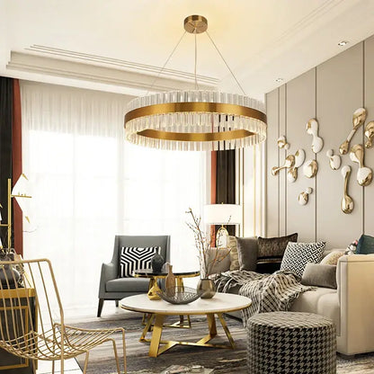 A modern decorbites crystal chandelier led ring with gold-toned metal frame and hanging crystal droplets for dining room decor