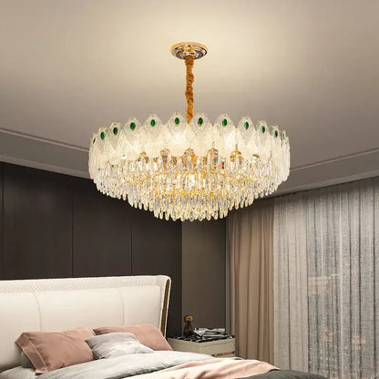 Decorbites crystal chandelier light with gold-toned stem, green gemstone accents, and cascading clear crystals for living room