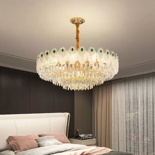 Decorbites crystal chandelier light with gold-toned stem, green gemstone accents, and cascading clear crystals for living room