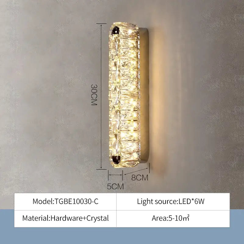 A 30cm tall decorbites crystal chandelier wall sconce with textured crystal design and embedded LED lights
