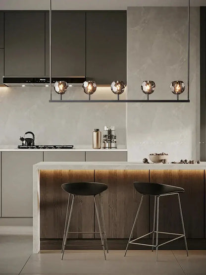 Modern black bar stools with slender metal legs beneath decorbites crystal chandelier lights for kitchen island decor