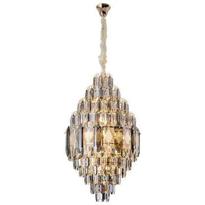 Decorbites crystal chandelier with cascading clear and gold glass prisms suspended from a polished brass fixture
