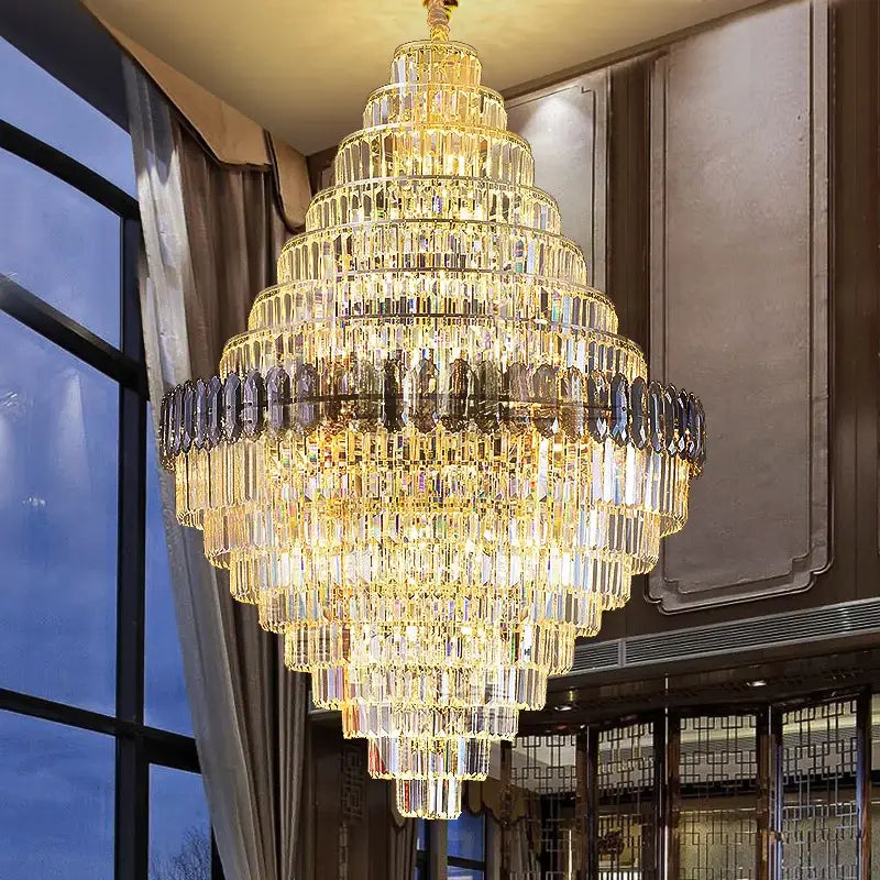 DecorBites crystal chandelier with cascading golden and clear glass prisms for penthouse villa stairwell lighting