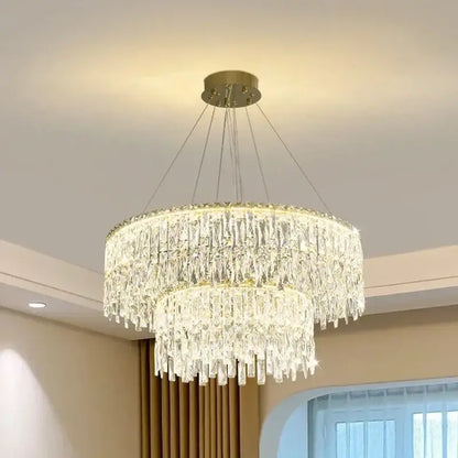 DecorBites crystal chandelier with two tiers of clear glass prisms and gold-toned mount for luxury bedroom lighting