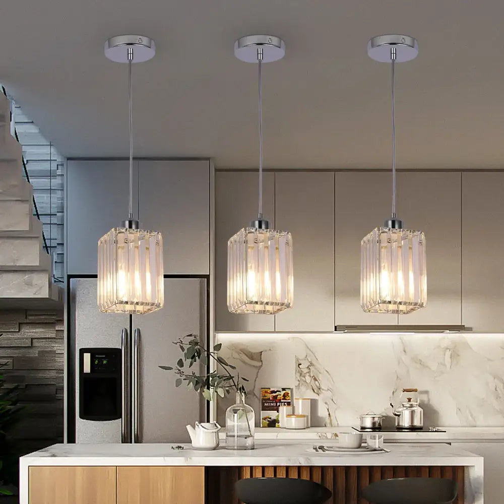 Three decorbites crystal chandelier pendant lights with clear faceted glass shades and chrome fixtures for indoor use