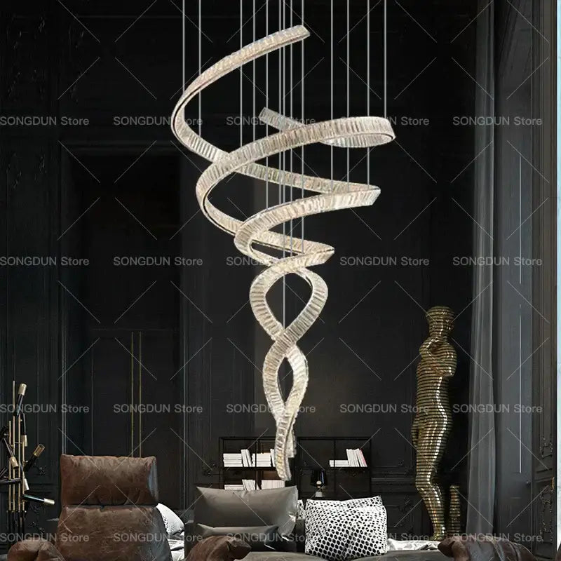 A modern decorbites crystal chandelier with a sleek silver finish and crystal accents for luxury designer light spaces