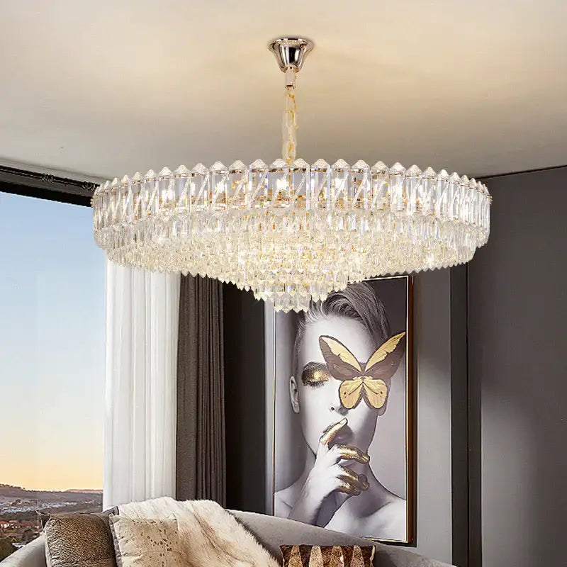 Circular decorbites crystal chandelier with polished chrome mount and faceted clear crystals for elegant living areas