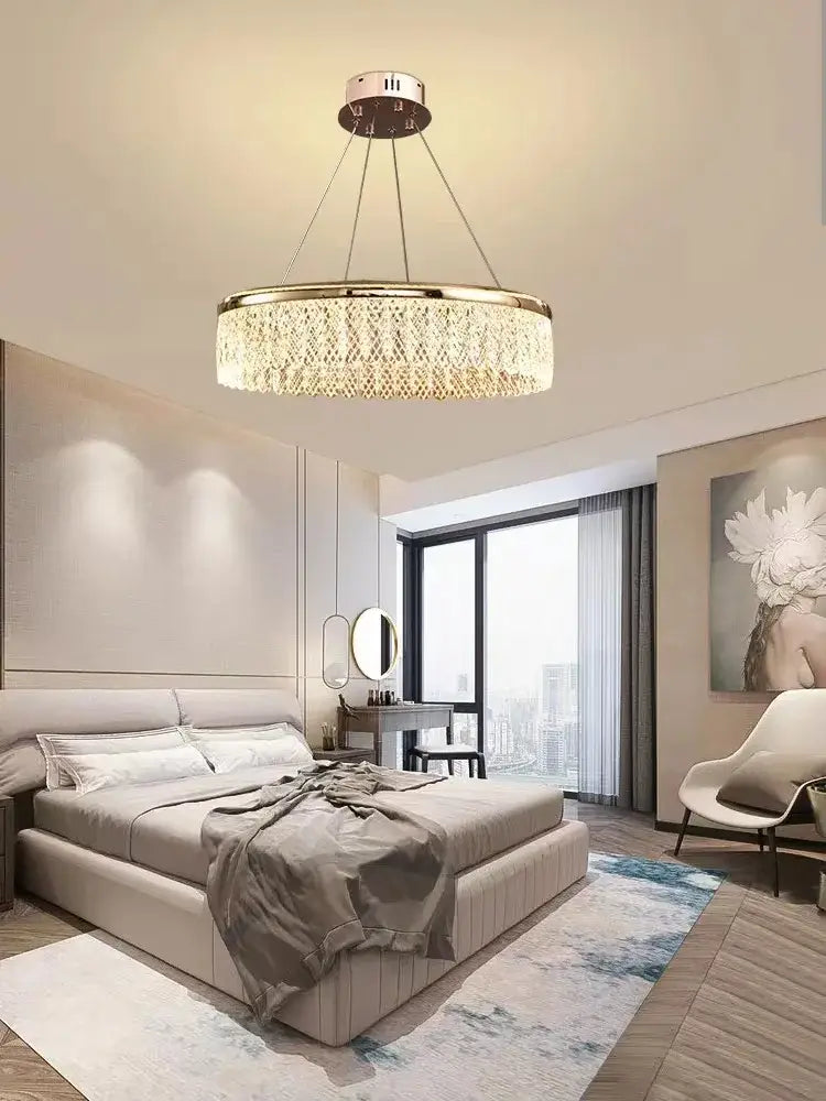 Gold-toned decorbites crystal chandelier with circular crystal-encrusted design for luxury living and dining lighting