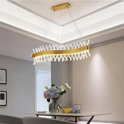 Gold-toned decorbites crystal chandelier with modern geometric design and clear crystal elements for luxury lighting