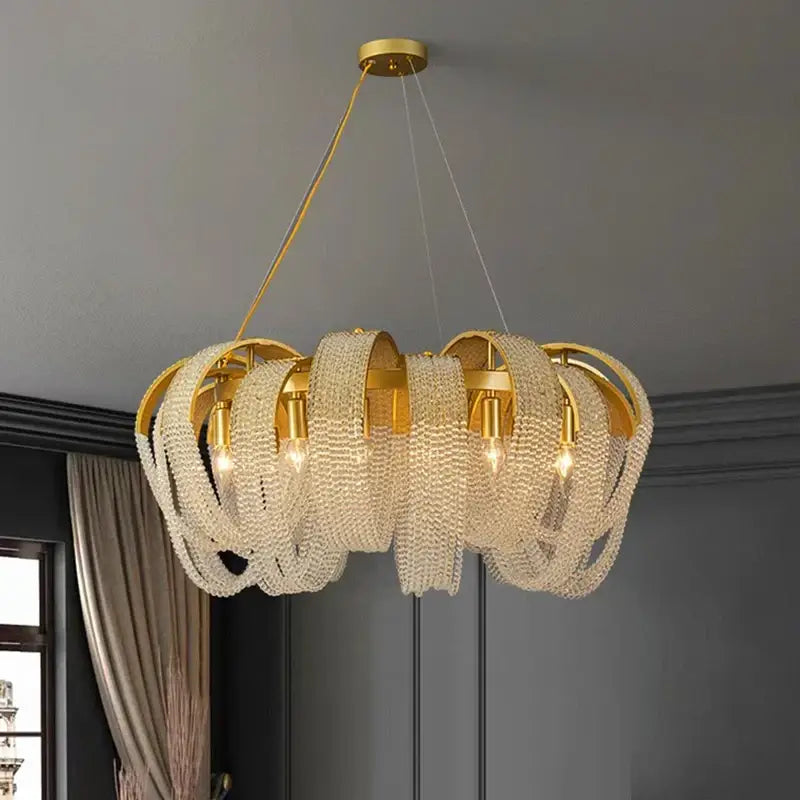 Gold-toned decorbites crystal chandelier with cascading clear crystal beads in layered circular design for luxury rooms