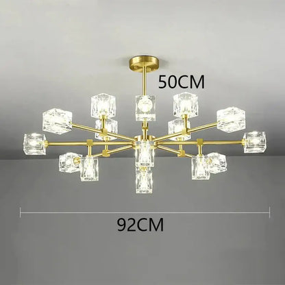 Gold-toned decorbites crystal chandelier with clear crystal cube shades for luxury living room and bedroom lighting