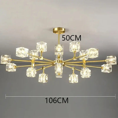 Gold-toned decorbites crystal chandelier with clear crystal cube shades in a modern branching design for luxury spaces