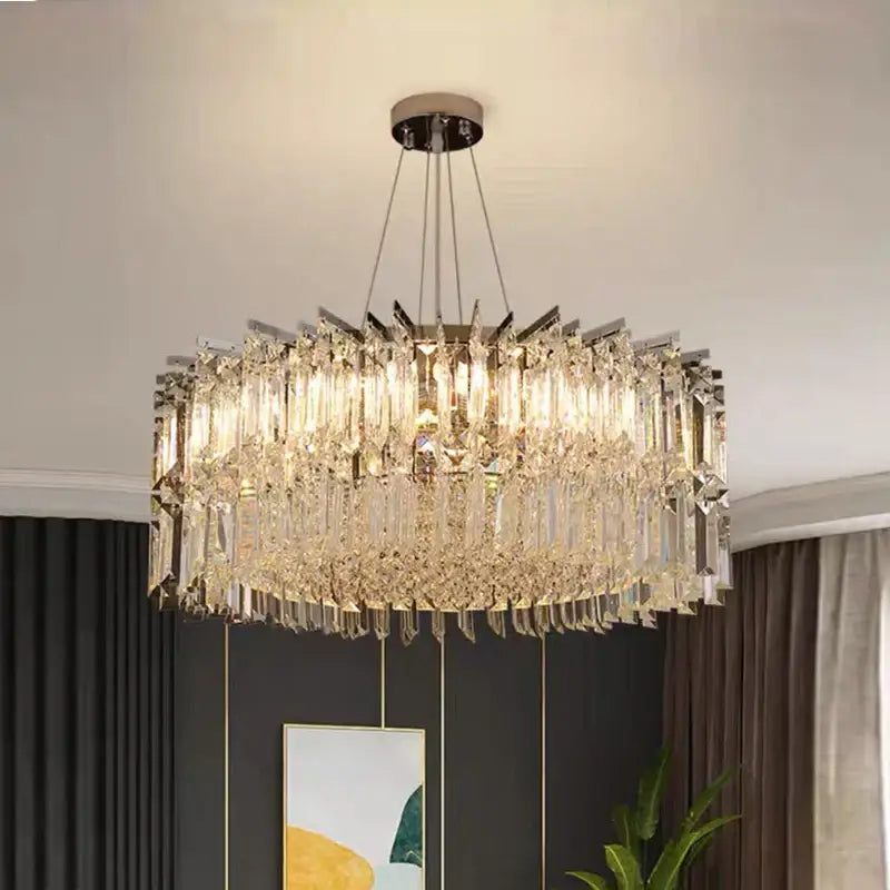 A modern decorbites crystal chandelier with cascading clear crystal prisms and polished chrome finish for luxury spaces