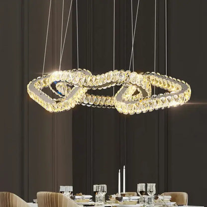 A decorbites crystal chandelier with double-looped design warm lights and sleek metallic frame for luxury spaces