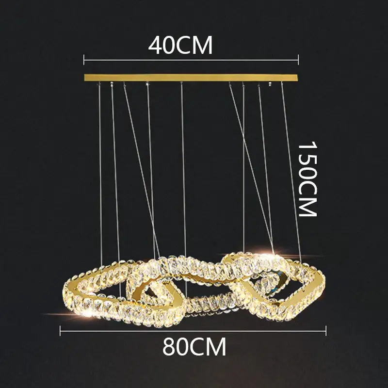Gold-toned decorbites crystal chandelier with interlocking rings and clear crystals for luxury living and dining rooms