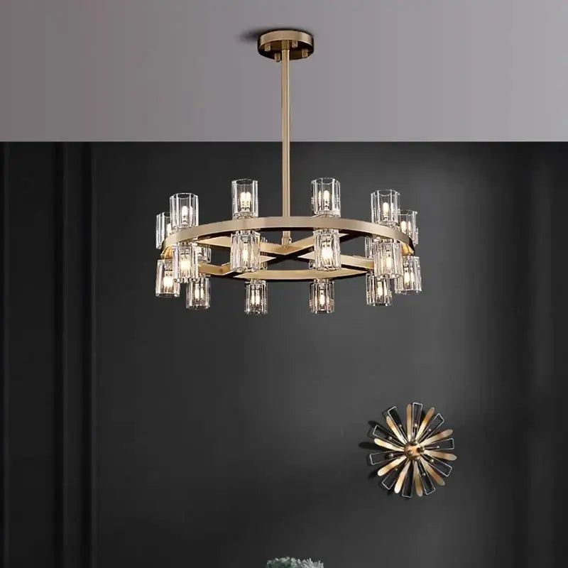 Gold-toned decorbites crystal chandelier with clear glass candle-style shades in a modern circular design for living rooms