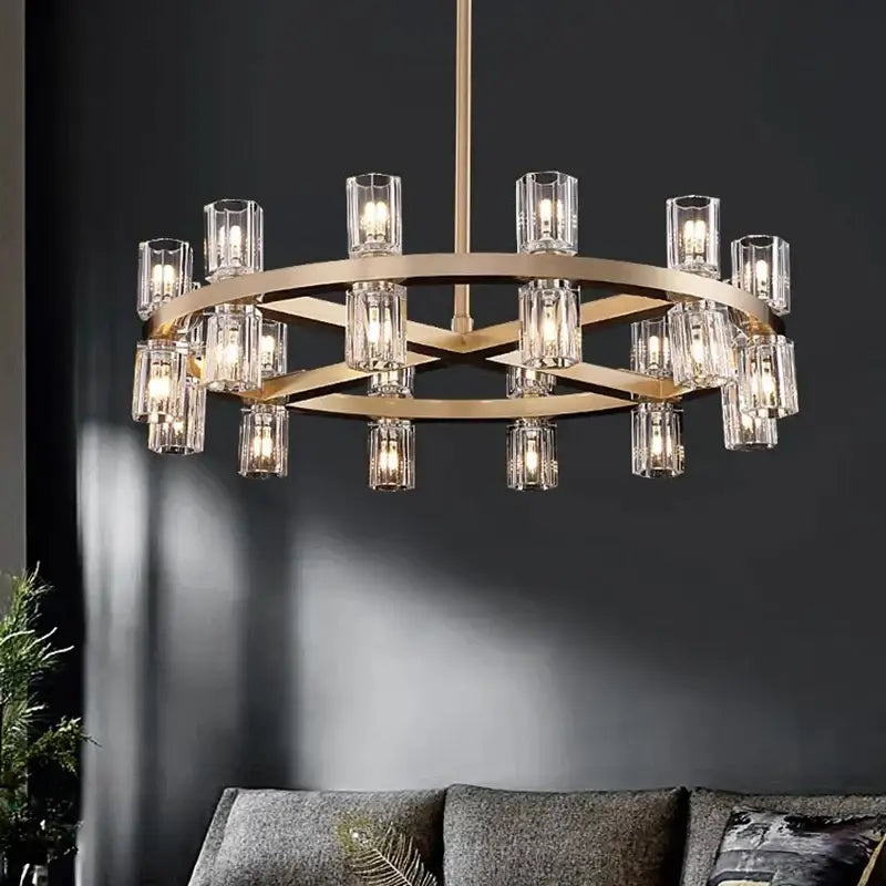 Gold-toned decorbites crystal chandelier with clear glass candle-style bulbs in a circular modern design for luxury living room