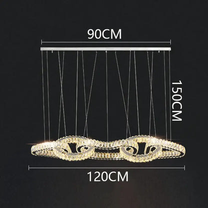 A modern 90cm x 150cm decorbites crystal chandelier with silver frame and cascading crystal rings emitting warm light