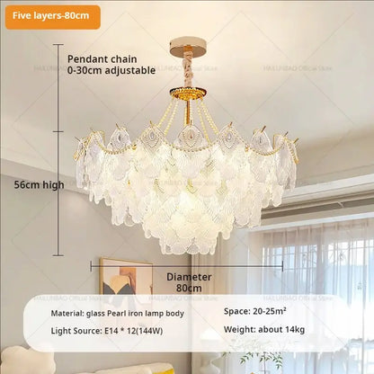 A five-layered decorbites crystal chandelier with gold-toned iron frame and white pearl glass shells for elegant lighting