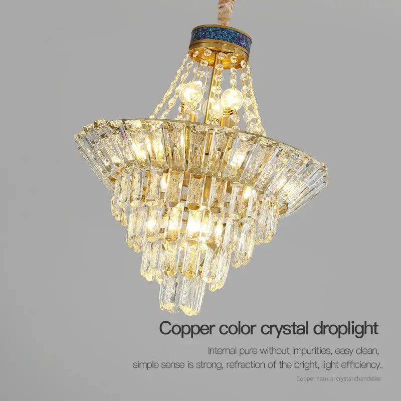 Copper-colored decorbites crystal chandelier with tiered faceted glass and blue mosaic accent for luxury living rooms