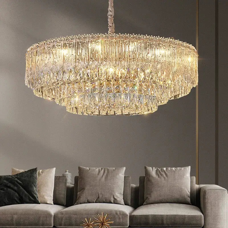 DecorBites crystal chandelier multi-tiered with cascading faceted glass prisms and warm golden lighting for modern rooms