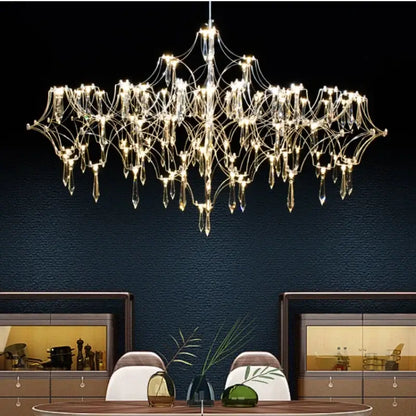 A modern decorbites crystal chandelier with metallic frame and teardrop glass pendants for luxury living spaces