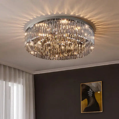 DecorBites crystal chandelier with multiple tiers of clear faceted crystal prisms on polished chrome frame