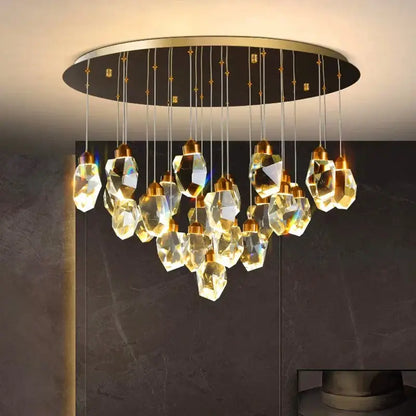 A decorbites crystal chandelier featuring faceted golden glass pendants on a sleek circular gold frame for living rooms