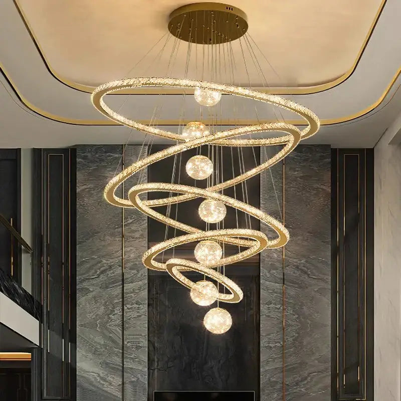 Golden spiral decorbites crystal chandelier with crystal-encrusted rings and spherical lights for indoor lighting