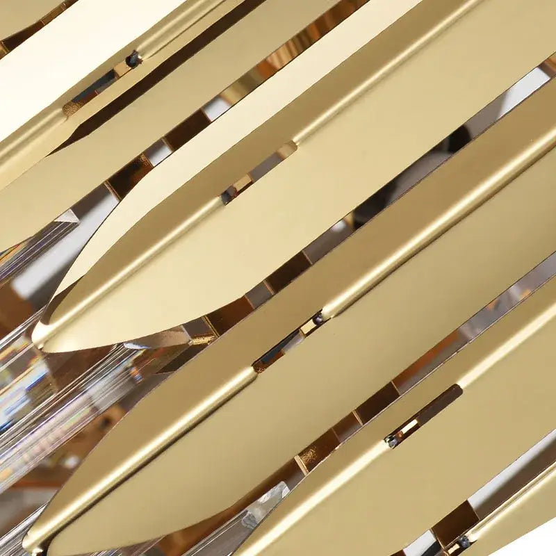 Gold-toned metallic leaf-shaped decorbites crystal chandelier with clear crystal accents for modern dining room lighting