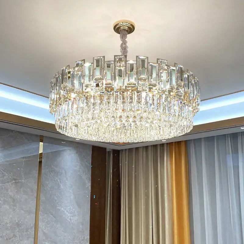 Decorbites crystal chandelier with multi-tiered clear faceted glass prisms and gold-toned mount for elegant lighting
