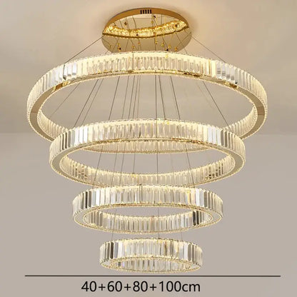 Decorbites crystal chandelier with five concentric rings of clear crystal prisms in a gold-toned metal frame for modern lighting
