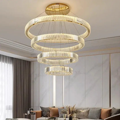 A modern decorbites crystal chandelier featuring gold-toned concentric rings with clear crystal prisms for home lighting