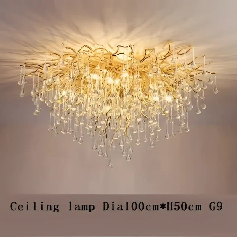 Golden crystal chandelier with intricate branching and teardrop crystals by decorbites crystal chandelier for luxury lighting