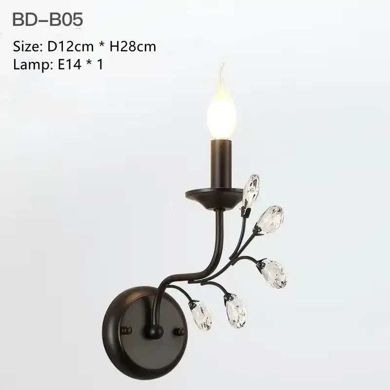 Black wrought iron wall sconce with crystal teardrop accents and e14 bulb from decorbites crystal chandelier collection