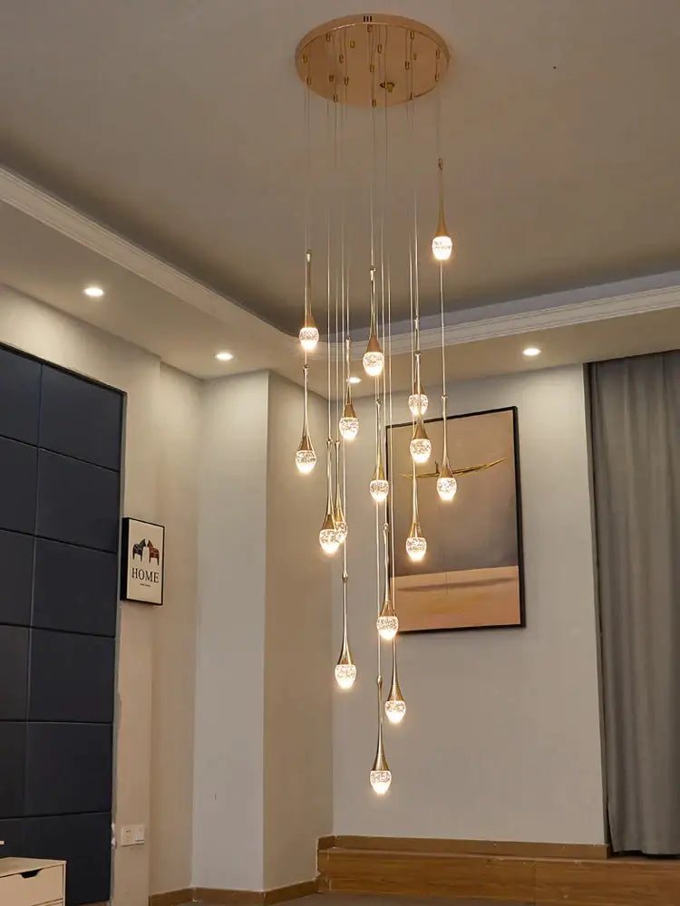Gold-toned decorbites crystal chandelier with multiple dangling teardrop crystal pendants modern LED staircase light