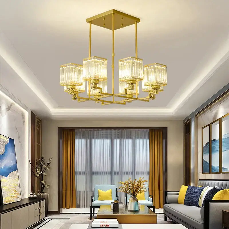 Gold-toned decorbites crystal chandelier with rectangular crystal glass shades and geometric metal frame for modern luxury lighting