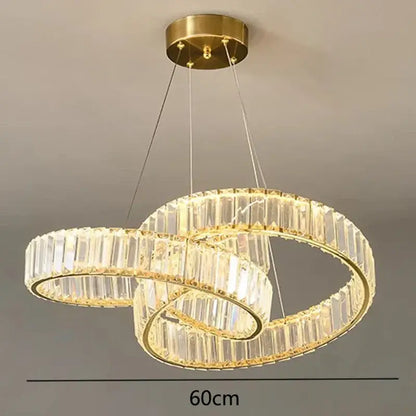 Gold-toned double-ring decorbites crystal chandelier with clear crystal facets and integrated led lighting for modern living rooms
