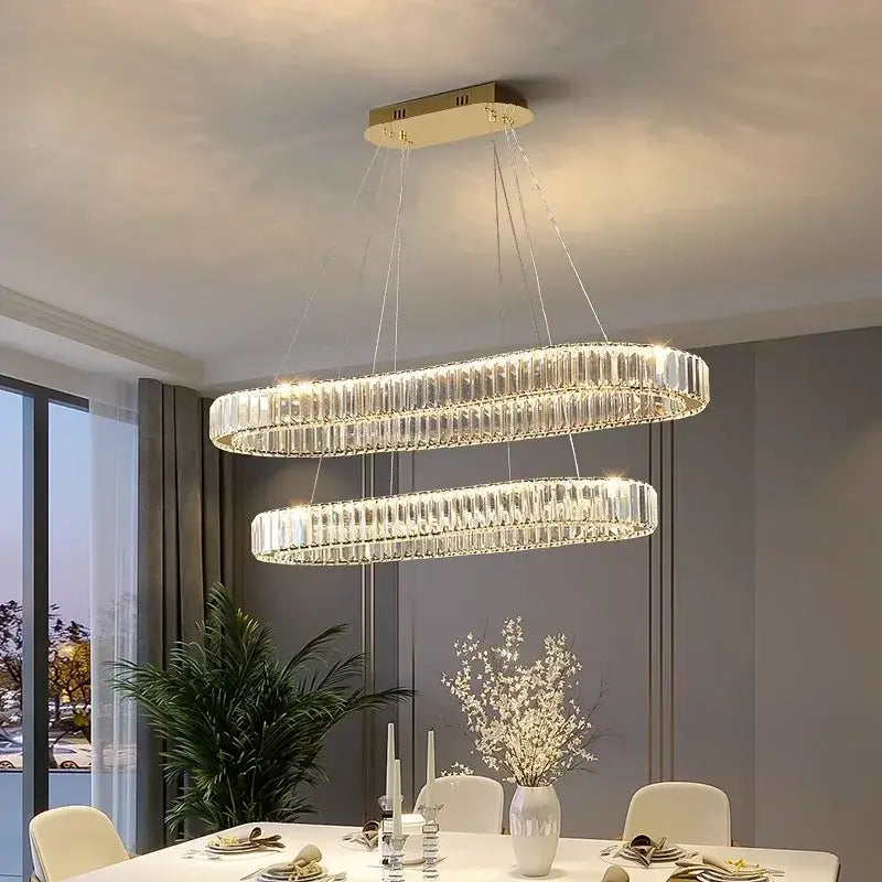 Modern double-ring decorbites crystal chandelier with clear crystal rods and gold-toned ceiling mount for living room