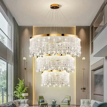 Decorbites crystal chandelier with gold-toned metal accents and cascading clear crystals for modern living rooms