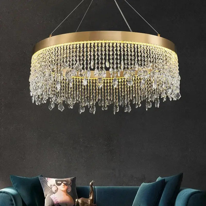Gold-toned decorbites crystal chandelier with cascading clear crystal droplets for modern living and dining rooms