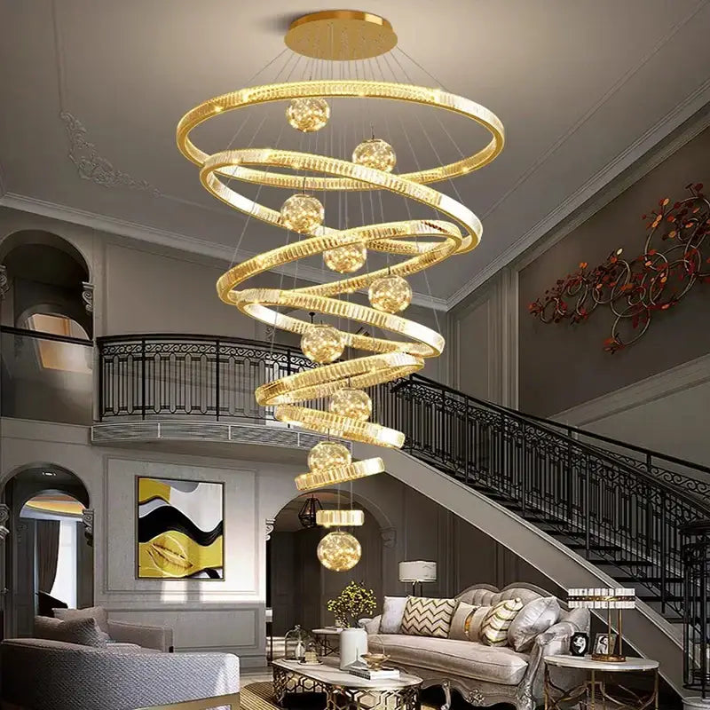 DecorBites crystal chandelier golden spiral design with crystal spheres and polished metallic finish for elegant lighting
