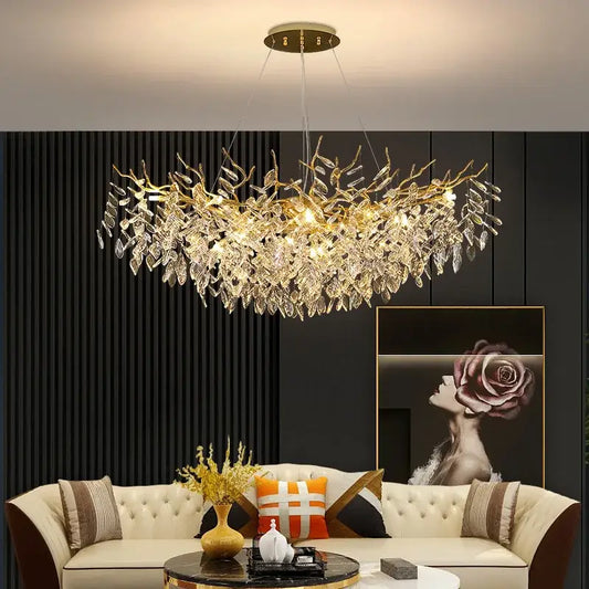 Gold-toned decorbites crystal chandelier with intricate crystal leaf and branch design for living room and hotel use