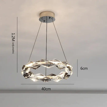 Decorbites crystal chandelier featuring a modern circular design with faceted clear glass rings and chrome mount