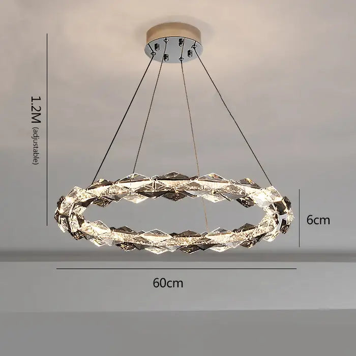 A modern decorbites crystal chandelier with faceted crystals and chrome accents for luxury duplex staircase lighting