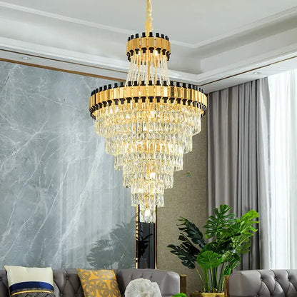 A DecorBites crystal chandelier with gold-toned metal frames and clear crystal prisms for luxury duplex villas and banquet halls